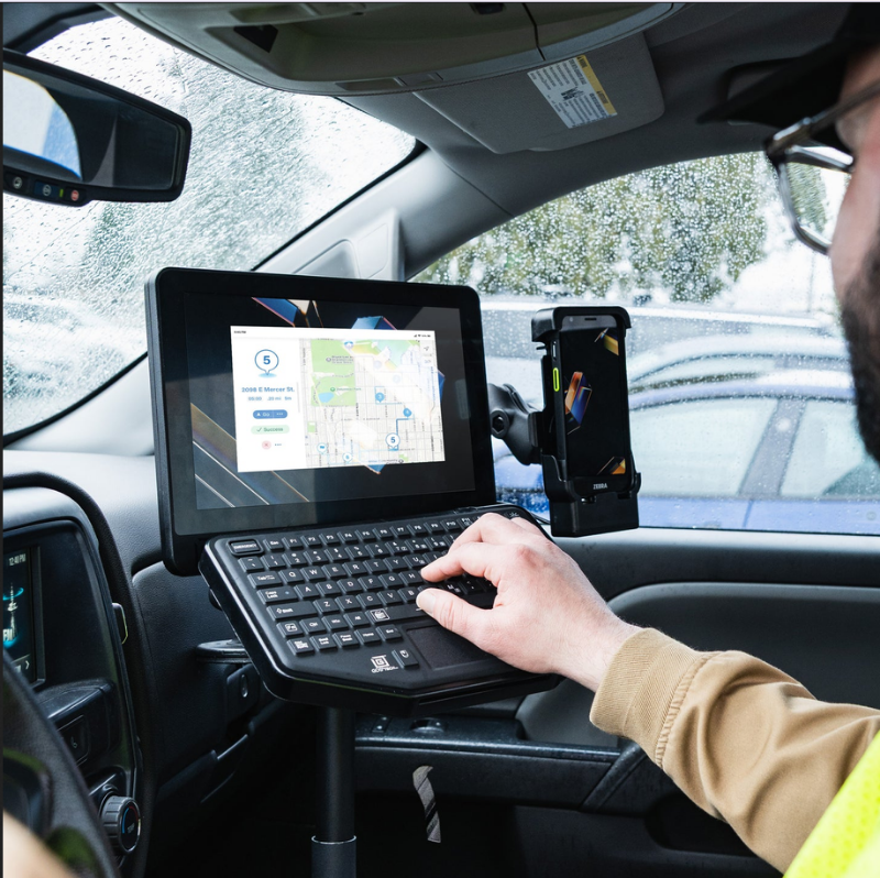RAM-KB2-USB GDS® Keyboard™ with Track Pad installed in truck with tablet and phone on swing base