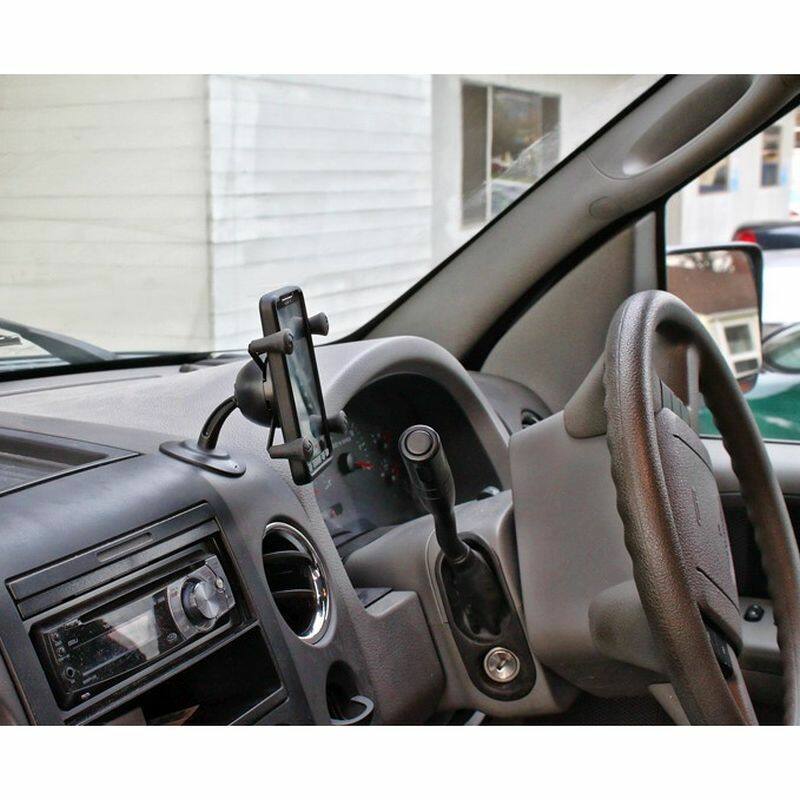RAP-SB-180-UN7U Lil Buddy™ Adhesive Stick Base Mount with Universal X-Grip® Cell Phone Cradle on dashboard in SUV