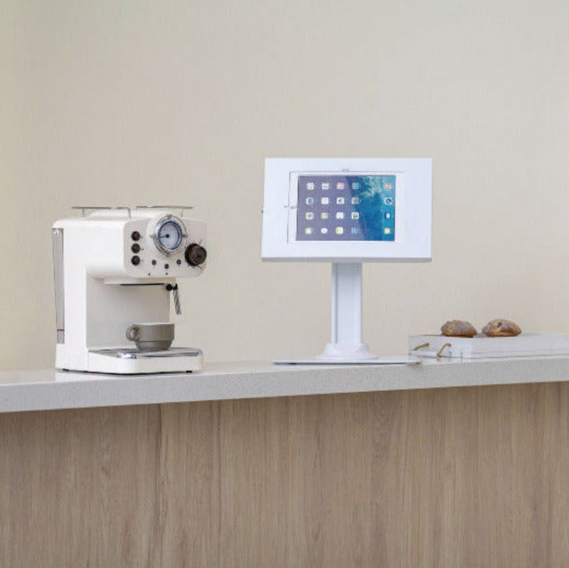 Brateck PAD34-03 anti-theft tablet kiosk in a public countertop setting, matte white